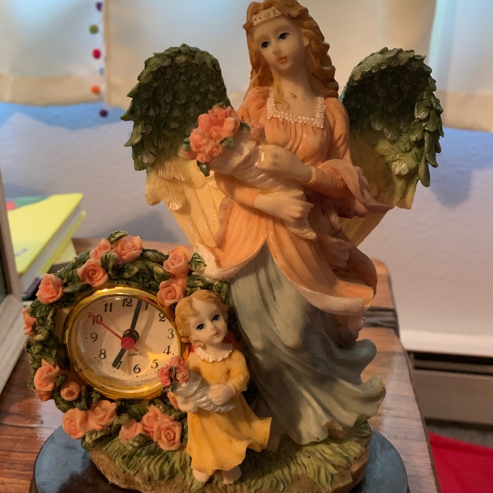 Old antique angel clock